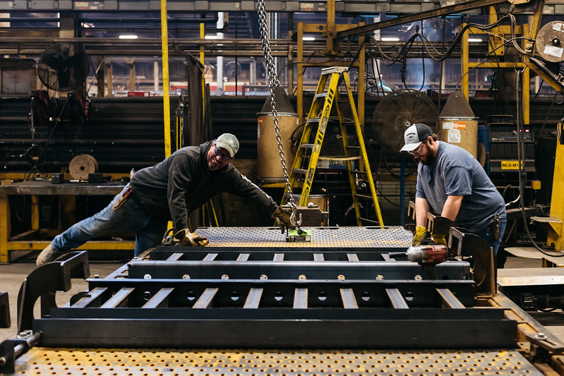 Two men working in a manufacturing plant.