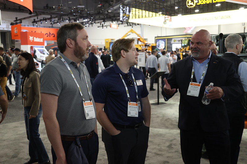 An AEM employee talks with representatives from OSHA at CONEXPO-CON/AGG 2026.