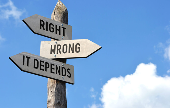 A sign pointing in three directions, reading 'the right way, 'the wrong way', and 'it depends'.